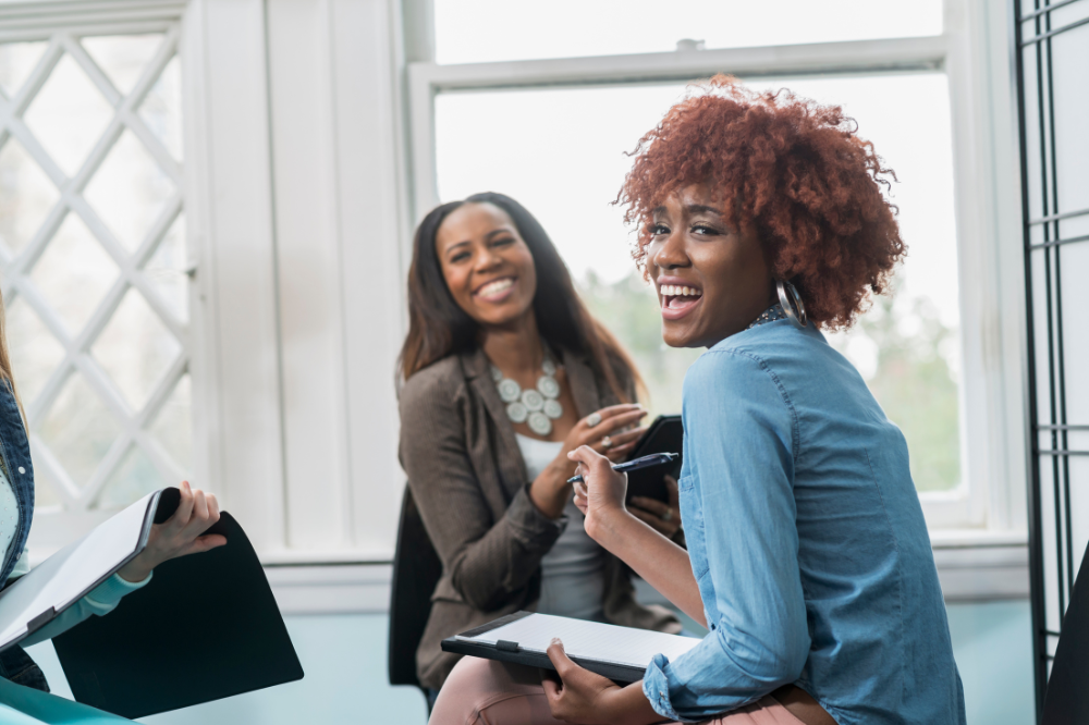 Black women entrepreneurs discussing business strategies for growth.